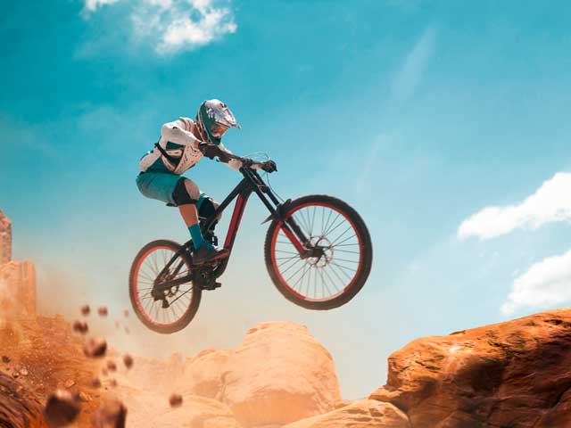Cyclist riding a bicycle. Downhill.